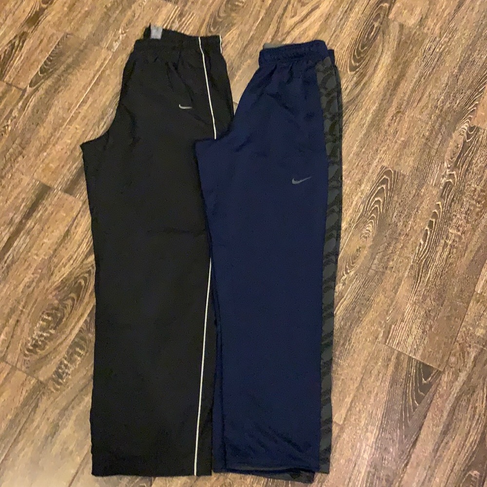 2 men Nike sweatpants